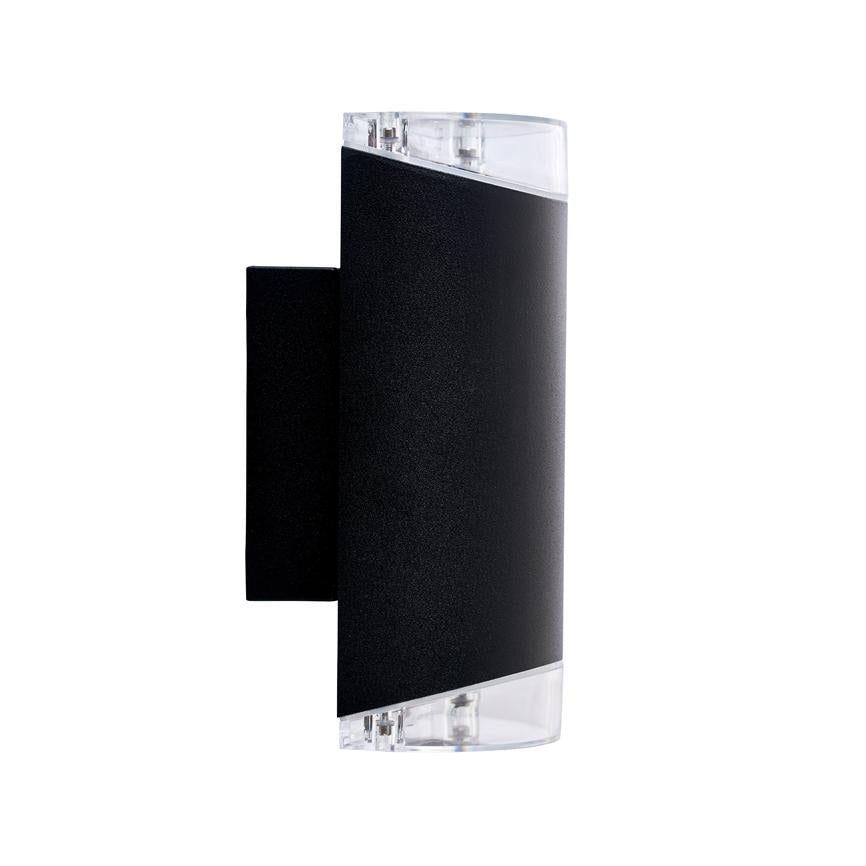 Sort væglampe med buet front og klare plastender, monteret lodret; designet til at kaste lys opad og nedad, vist mod neutral hvid baggrund.