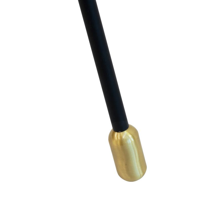 Sort metalstang med en afrundet, messingfarvet kappe, som peger skråt nedad mod en ensartet hvid baggrund.