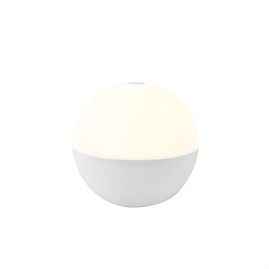 Rund, tofarvet bordlampe udsender blødt, varmt lys; øverste halvdel er oplyst, nederste halvdel mat hvid. Stilren, minimalistisk form placeret på neutral hvid baggrund.